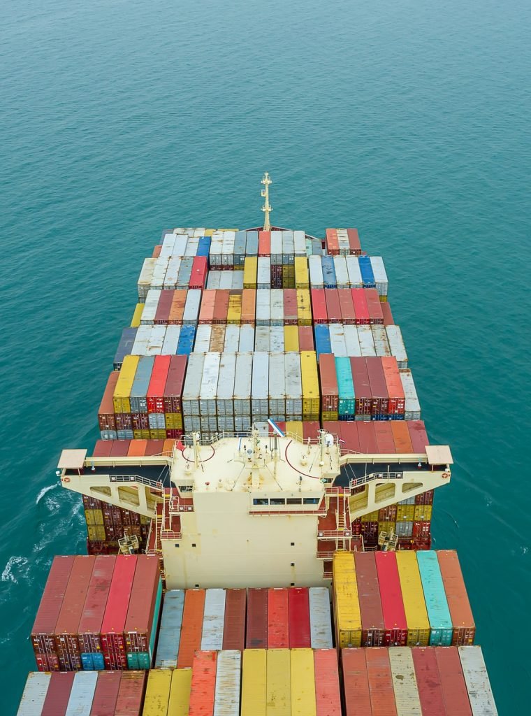 aerial-top-view-of-cargo-ship-carrying-container-for-import-export-goods-to-customer.jpg